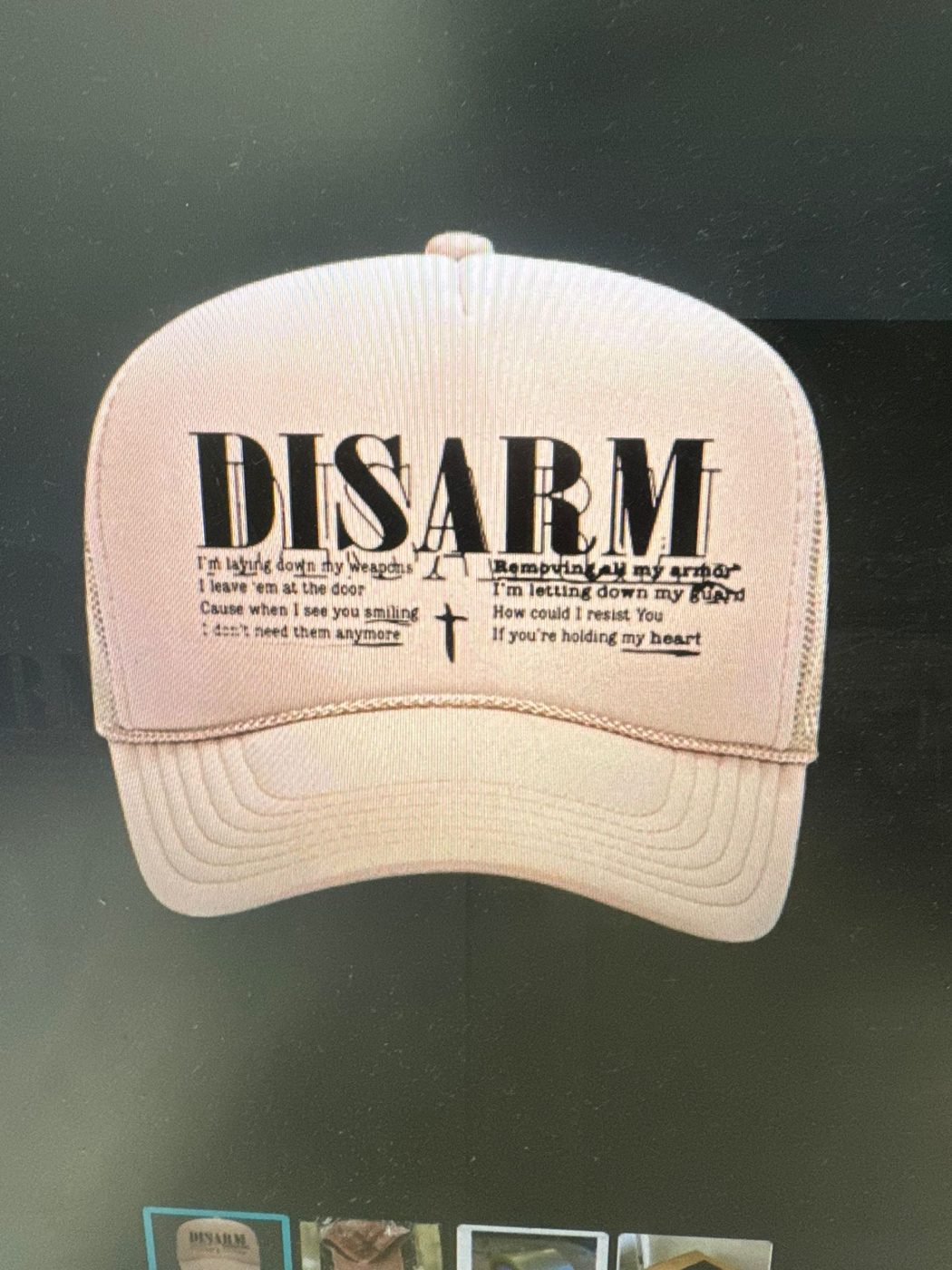 Pink trucker hat with a printed Disarm design by Ray's Print