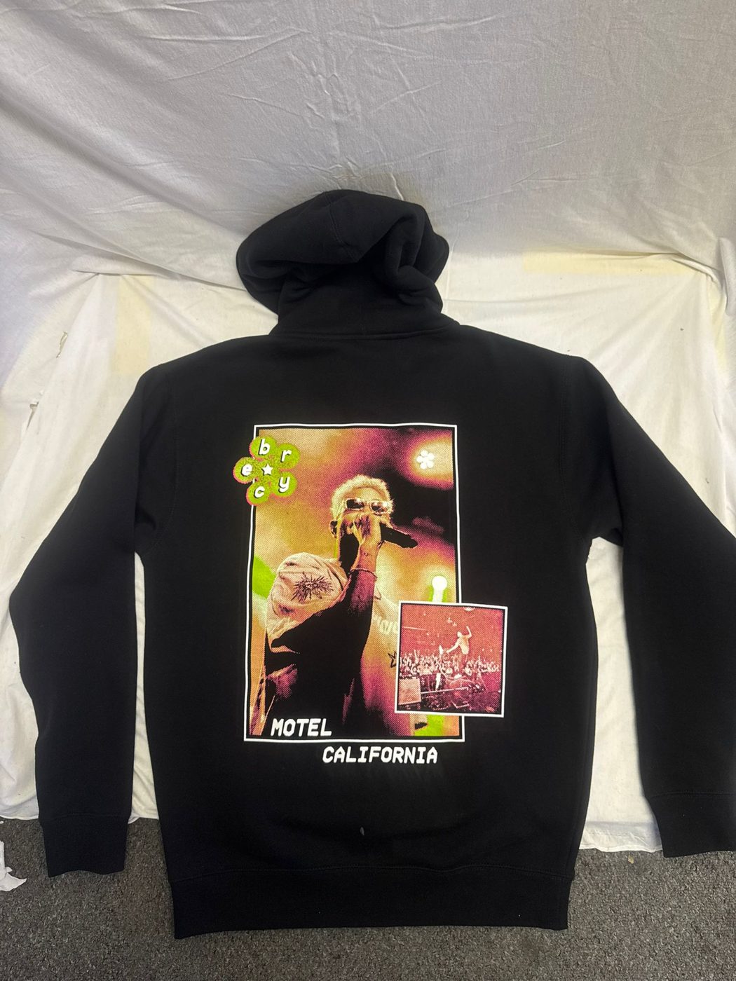 Black hoodie with a full-color Hotel California back print by Ray's Print